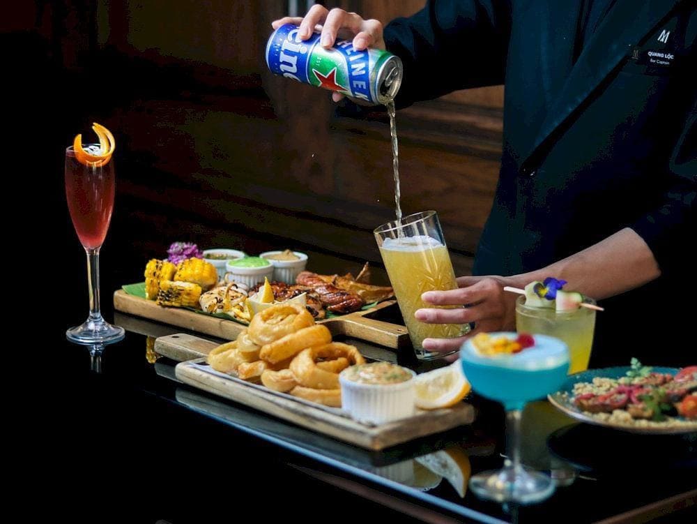 An elegant drink table featuring handcrafted cocktails and upscale finger food (Source: Social Club Rooftop Bar)